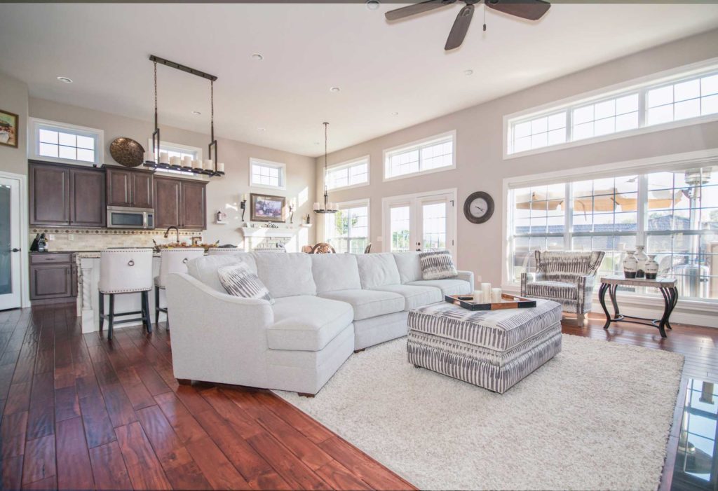 Kitchen and Living Area with Wood Floor, Cabinets, and Island